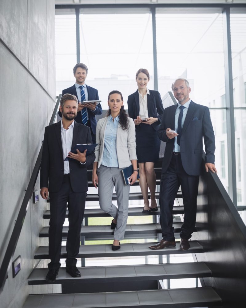 group-confident-businesspeople-office